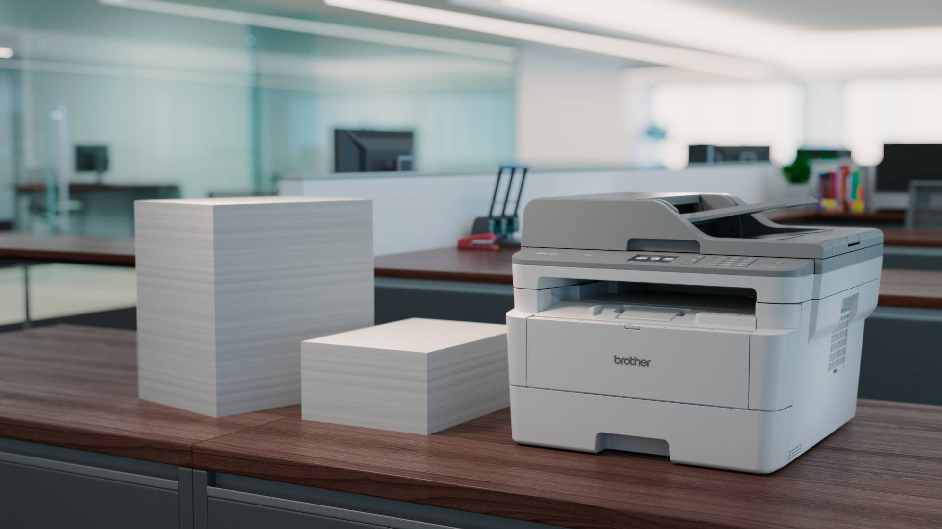 Brother printer on a cabinet with 2 stacks of paper.