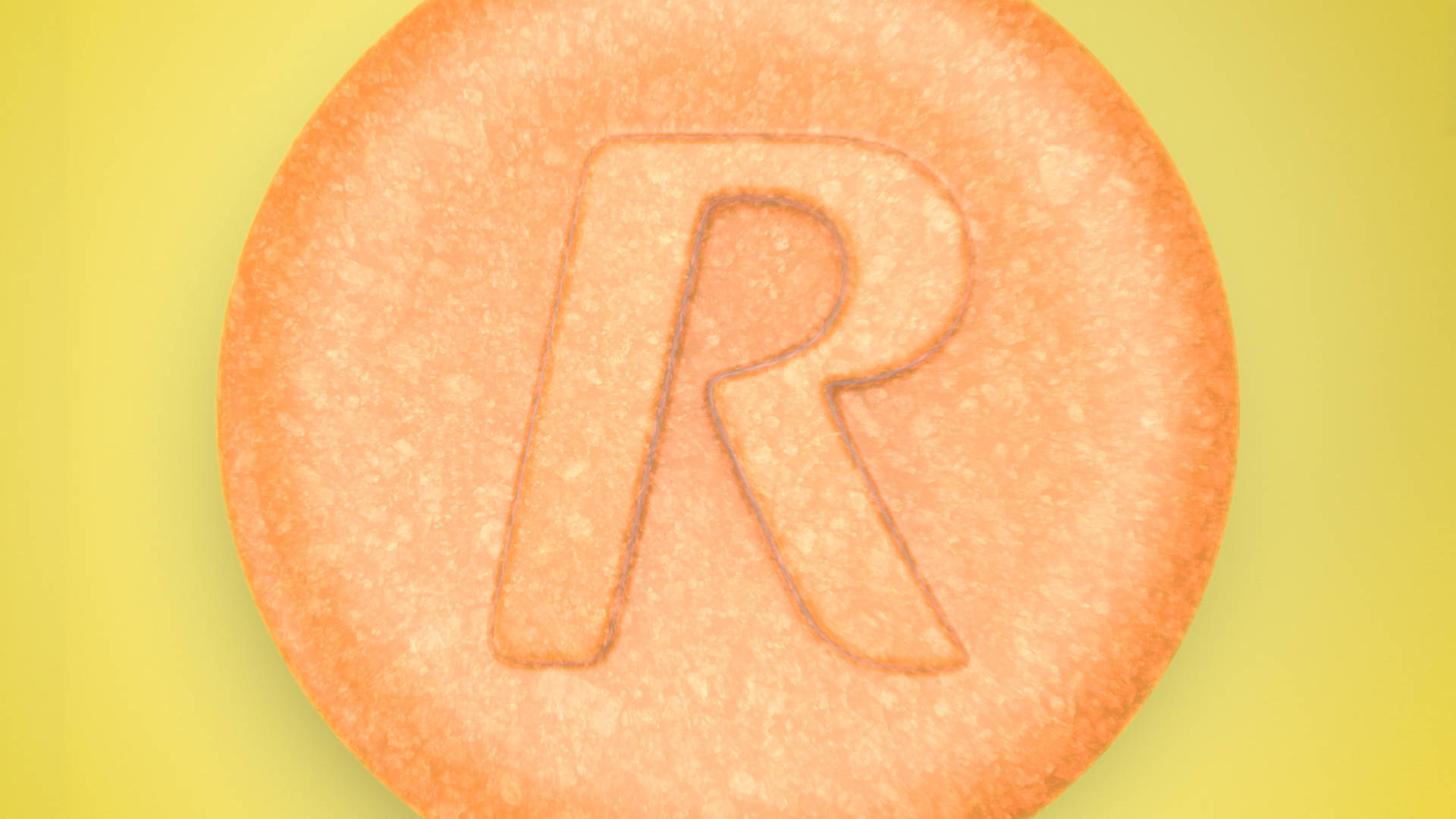 Close-up of a Rolaids tablet on a yellow background.